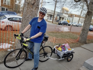 Person delivering goods on bike. (The Washington Post)